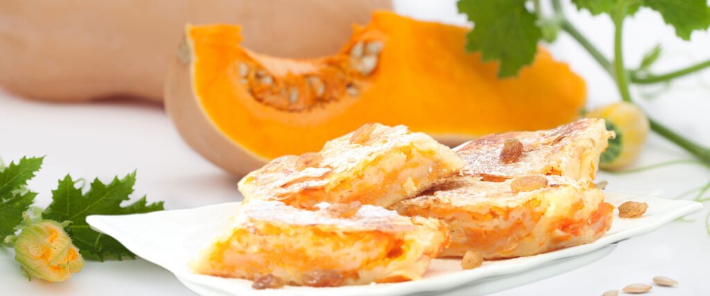 Pumpkin strudel with pumpkins in the background